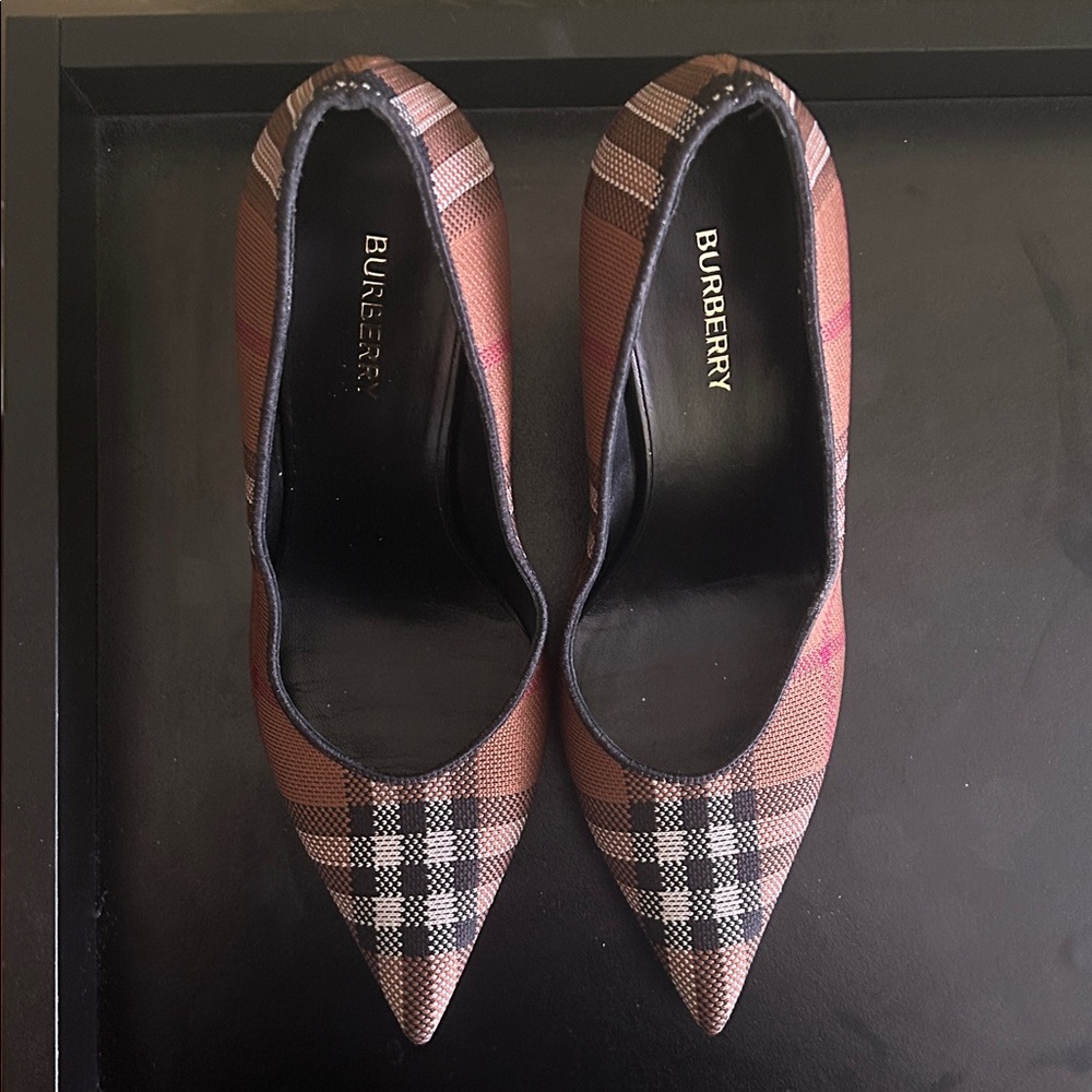 Used Burberry Brown Pumps. Comes with dust bag, tag, and shoe box.